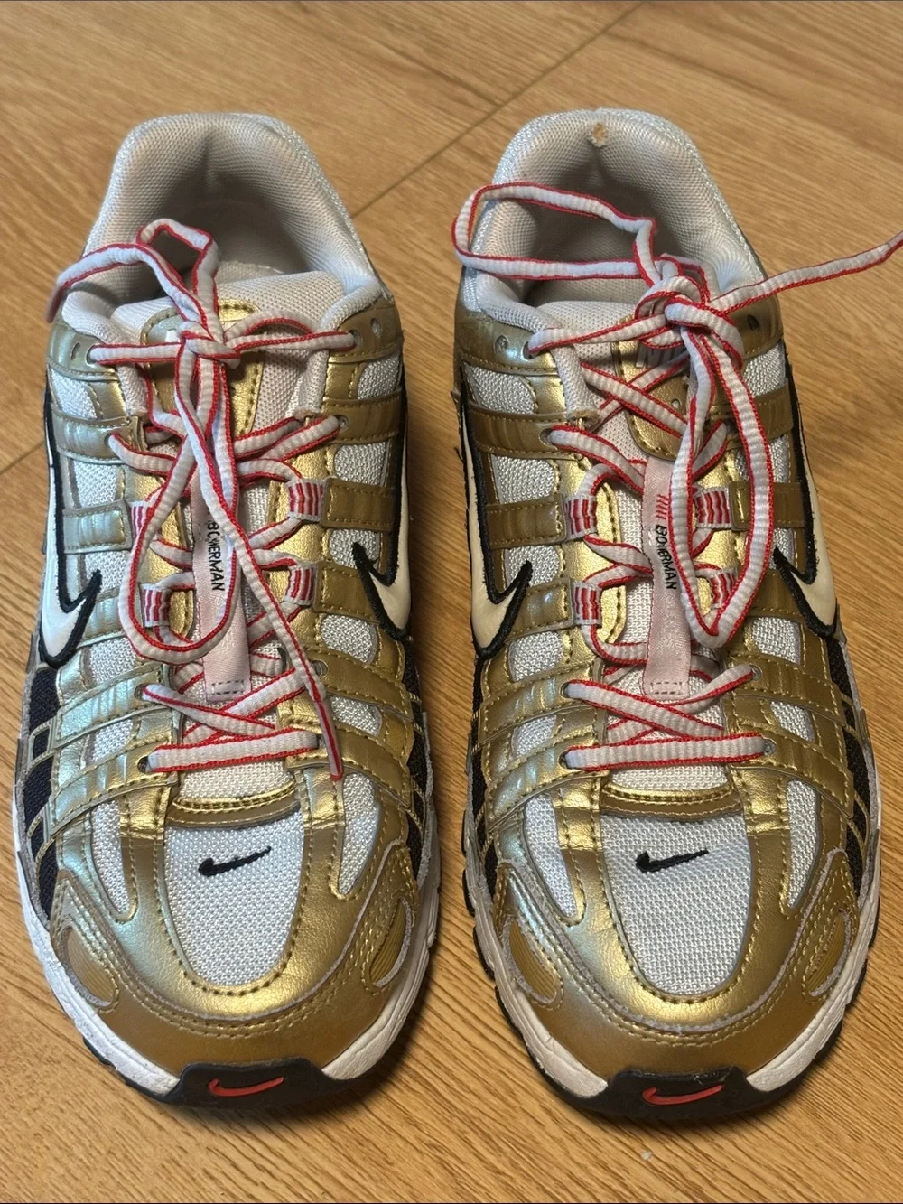 Nike BOWERMAN Metallic Gold, White & Black Athletic Sneakers with Red Details